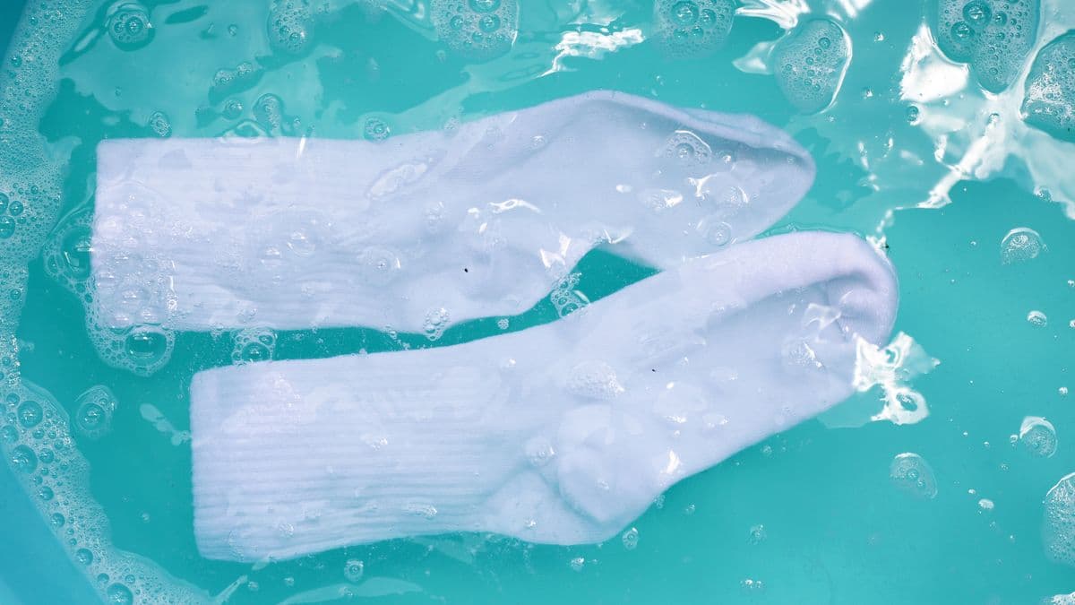 Clean stained socks with liquid detergent and baking soda